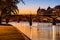 Sunrise on the Seine River banks and Pont des Arts, Paris, France