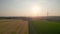 Sunrise serenity: aerial view of rural landscape with windmills
