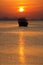 Sunrise and Silhouette of a Dhow