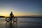 Sunrise silhouette of a man with fatbike