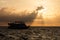 Sunrise Silhouettes Boat in the Caribbean