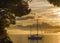 Sunrise silhouettes boat in Port Angeles Washington
