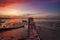 Sunrise Single Boat and Boatshed with Burning Sky.