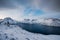 Sunrise on snowy Segla peak on Senja island in winter