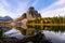 Sunrise on Sunburst Lake with Mount Assiniboine in autumn forest at provincial park