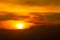 Sunrise-Sunset with clouds, light rays and other atmospheric effect.Brilliant orange sunrise over clouds with bright yellow sun on