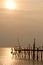 Sunrise at traditional wooden bridge on the beach.