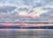 Sunrise With Transport Boats and Pink Mountains