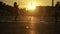 Sunrise. Two fitness girls warm up before jogging on the street.