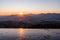 Sunrise in the valley of a beautiful green field in spring with fog, Czech Beskydy Frenstat pod Radhostem