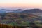 sunrise in the valley of a beautiful green field in spring with fog, Czech Beskydy Frenstat pod Radhostem