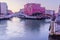 Sunrise view of colorful buildings, canals, boats, and bridges, Venice