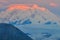 Sunrise view of Mount Denali - mt Mckinley peak with red alpenglow from Stony Dome overlook. Denali National Park and