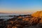 Sunrise with a view at a stony shore