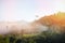 Sunrise village thailand with foggy landscape mountains misty forest with tree and house in the moring winter nature - View of