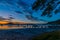 Sunrise waterscape with boats and clouds