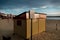 Sunrise in Weymouth\\\'s beach with a cool yellow hut