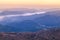 Sunrise white fog in early morning over high angle view of layer tropical mountains