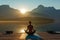 sunrise yoga practice on pier with mountain reflections
