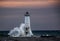 Suns rays illuminating Frankfort Lighthouse