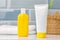 Sunscreen cosmetic containers in bathroom close up