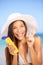 Sunscreen woman applying suntan lotion laughing