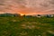 Sunset in Abisko National park in Northern Sweden. Hikers installing tents face to the grandiose landscape of Tornetrask lake and