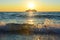 Sunset above the Adriatic sea in summer with cargo ship