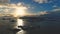 Sunset above Antarctica snow island, front aerial view.