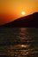 Sunset above bay and foothill of surrounding mountains near Paklenica, Croatia
