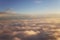 Sunset above the clouds landscape from an airplane journey