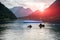 Sunset above divers entering the lake in high Alps Austria