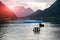 Sunset above divers entering the lake in high Alps Austria