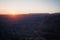 Sunset above mountains and canyon