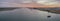 Sunset aerial panoramic seascape view of Olhao dockyard, waterfront to Ria Formosa natural park