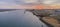 Sunset aerial panoramic seascape view of Olhao dockyard, waterfront to Ria Formosa natural park