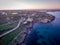 Sunset aerial view of the coastline of Portopalo and the Tafuri castle, Sicily, Italy