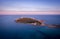 Sunset aerial view of the  island of Portopalo and its coastline, Sicily, Italy