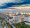 Sunset aerial view of Miami skyline from helicopter. Buildings, water and major city road