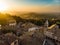 Sunset aerial view of San Marino microstate and Emilia-Romagna region of Italy from the rooftops of the city of San Marino