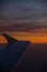 Sunset from the airplane window. Beautiful view. Sky. Red. Colorful