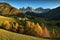 Sunset on The Alpine Village of Santa Magdalena in Val di Funes with the dolomitic group of the Odle on the background.