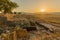 Sunset of ancient Israelite buildings, trees and landscape, Tel Hazor