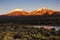 Sunset in Andes. Parinacota and Pomerade volcanos - Bolivia