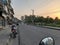 Sunset around a busy road. Parked bike view
