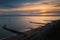 Sunset at the artificial beach of the western undercliff in Ramsgate, Kent, UK which has groins as water breakers