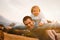 Sunset backdrop to father\\\'s uplifting child\\\'s play