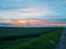 Sunset on the background of the field