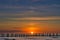 Sunset on the Baltic Sea. Sea, groyne strong colors. Vacation on the beach. Romantic