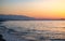 Sunset in the beach of Aegean sea in Adelianos Kampos resort, Crete island, Greece